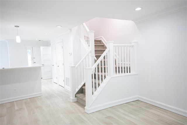 59 Stratford Grn Unit 59, Farmingdale, NY 11735 - stairway featuring wood finished floors, crown molding, and recessed lighting