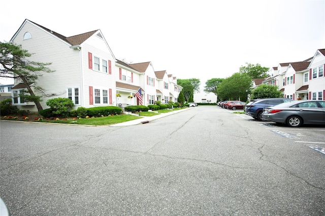 59 Stratford Grn Unit 59, Farmingdale, NY 11735 - view of asphalt street with a residential view