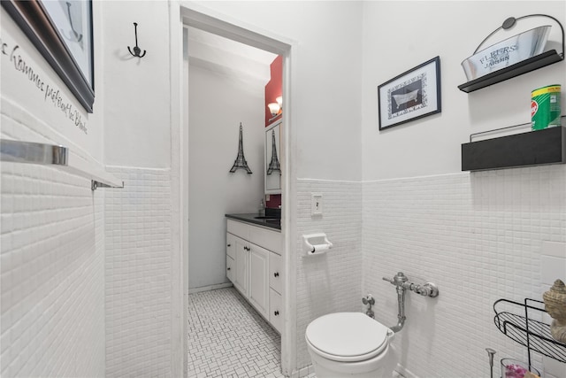 1 Balint Dr Unit 267, Yonkers, NY 10710 - bathroom featuring vanity, tile patterned floors, and a wainscoted wall