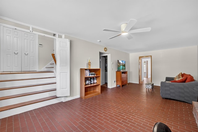 49 Oakridge Rd, North Salem, NY 10560 - living area with brick patterned flooring, a ceiling fan, and stairs