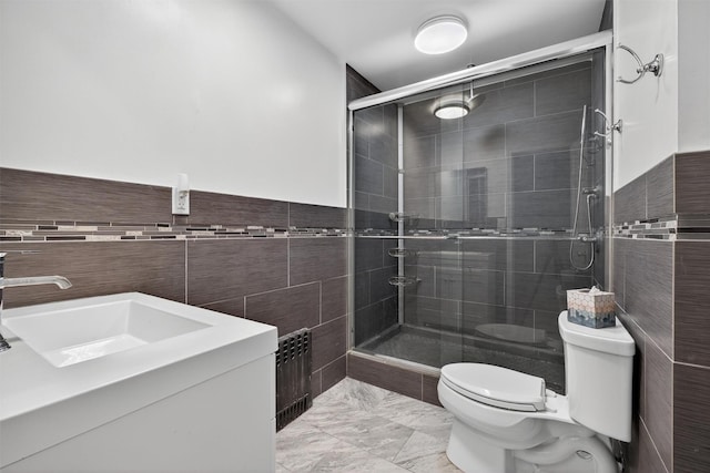 49 Oakridge Rd, North Salem, NY 10560 - bathroom with tile walls, a shower stall, marble finish floors, vanity, and radiator