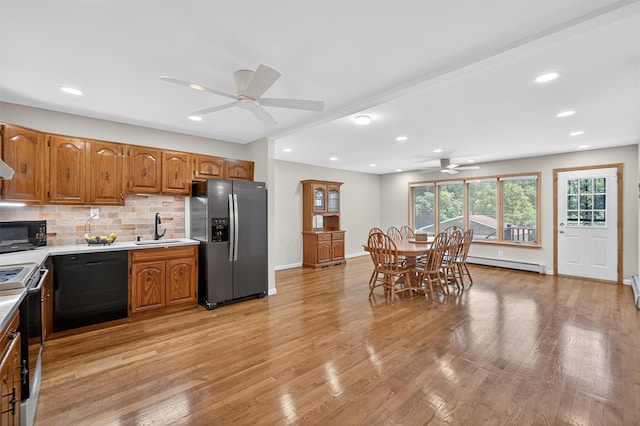 49 Oakridge Rd, North Salem, NY 10560 - kitchen featuring black appliances, ceiling fan, light countertops, tasteful backsplash, and brown cabinetry
