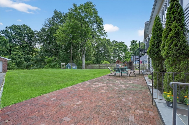 49 Oakridge Rd, North Salem, NY 10560 - view of patio / terrace featuring outdoor dining area, stairway, a storage shed, and view of scattered trees
