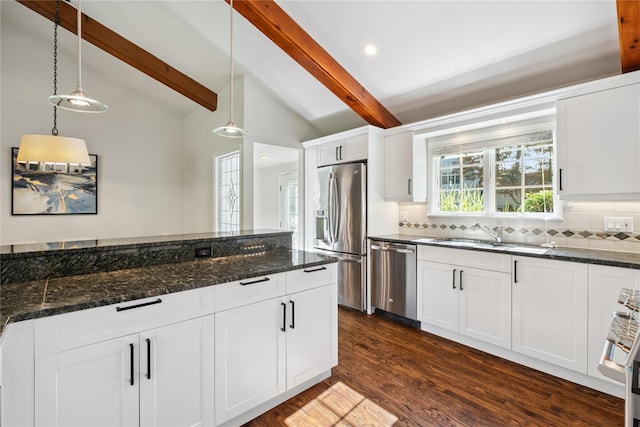 96 Highridge Rd, New Rochelle, NY 10804 - kitchen with stainless steel appliances, tasteful backsplash, decorative light fixtures, dark wood-style flooring, and white cabinetry