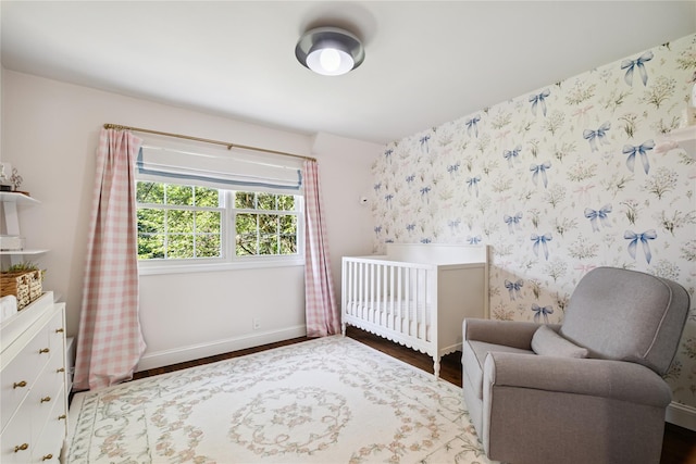 96 Highridge Rd, New Rochelle, NY 10804 - bedroom featuring wood finished floors and a crib