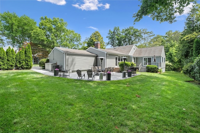 96 Highridge Rd, New Rochelle, NY 10804 - rear view of property featuring a patio area, a chimney, a lawn, and a wooden deck