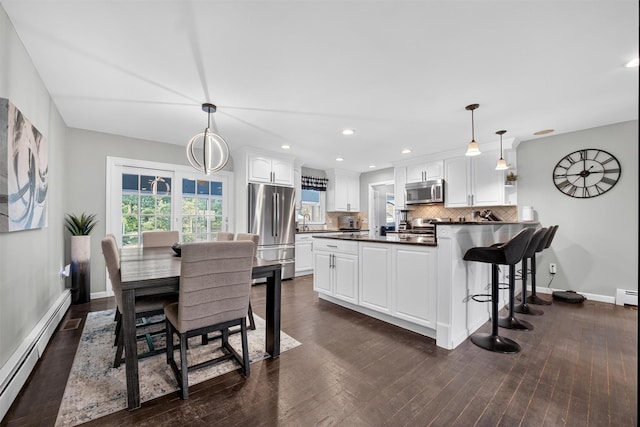 6 Spring Rock Rd, New Windsor, NY 12553 - dining space with a baseboard radiator, dark wood-style flooring, and recessed lighting