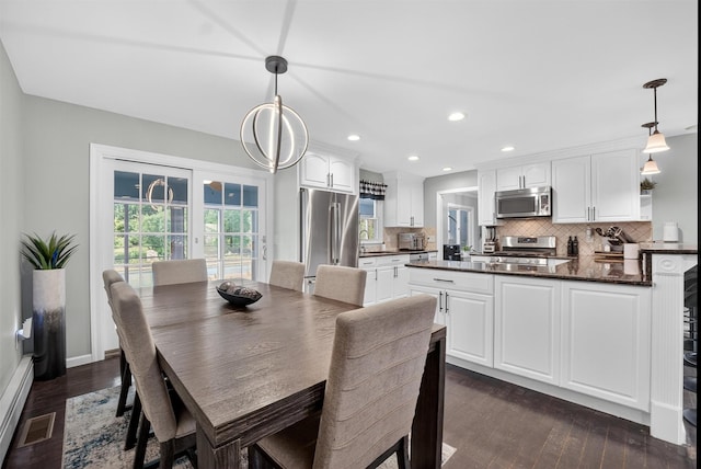 6 Spring Rock Rd, New Windsor, NY 12553 - dining area with dark wood finished floors, recessed lighting, and a baseboard radiator