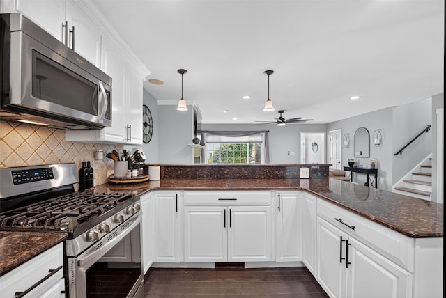 6 Spring Rock Rd, New Windsor, NY 12553 - kitchen with stainless steel appliances, ceiling fan, decorative backsplash, dark wood-style flooring, and white cabinetry