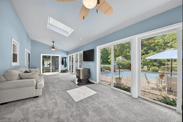 6 Spring Rock Rd, New Windsor, NY 12553 - sunroom / solarium with a wood stove, vaulted ceiling, and a skylight