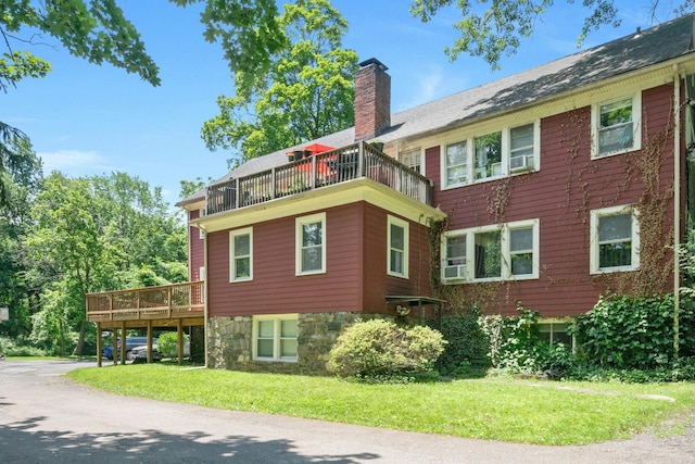 858 Pleasantville Rd, Briarcliff Manor, NY 10510 - view of property exterior featuring a balcony, a chimney, and a yard