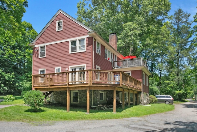 858 Pleasantville Rd, Briarcliff Manor, NY 10510 - rear view of house featuring a chimney, a deck, and a yard