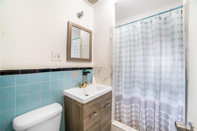 81-56 264th St, Glen Oaks, NY 11004 - full bath with tile walls, vanity, curtained shower, and wainscoting