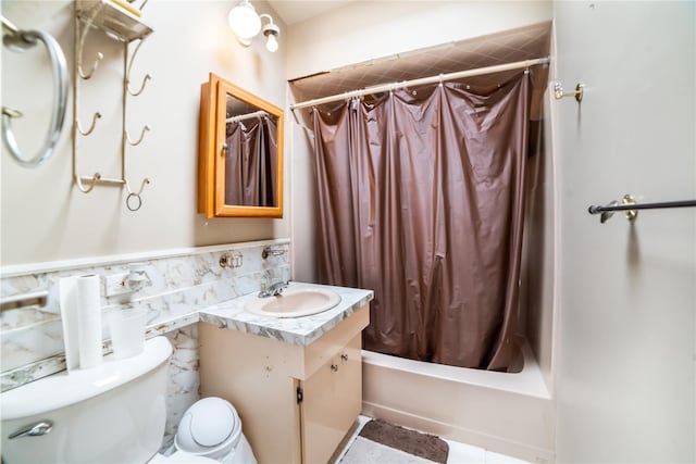 81-56 264th St, Glen Oaks, NY 11004 - full bath featuring vanity, shower / bath combo with shower curtain, a wainscoted wall, and tile walls