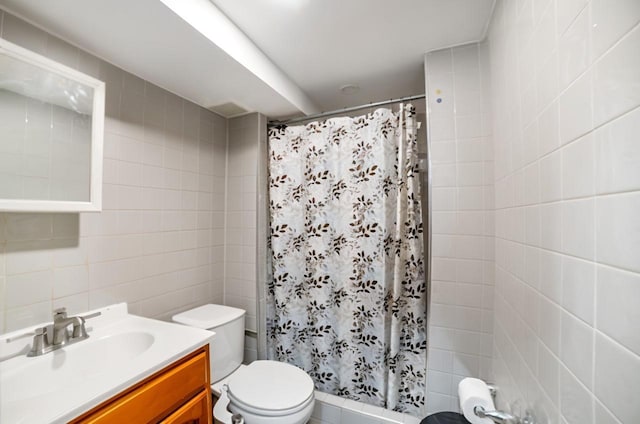 81-56 264th St, Glen Oaks, NY 11004 - full bathroom with tile walls, vanity, and a shower with shower curtain