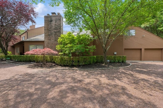 61 Hidden Cove Ct, Southampton, NY 11968 - view of side of home featuring a chimney