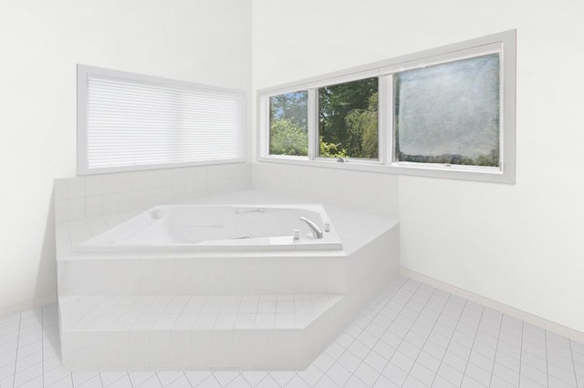 61 Hidden Cove Ct, Southampton, NY 11968 - full bath featuring a garden tub and tile patterned floors