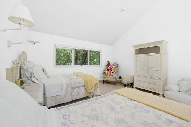 61 Hidden Cove Ct, Southampton, NY 11968 - bedroom with lofted ceiling and wood finished floors