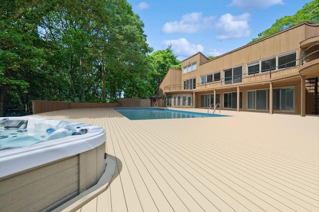 61 Hidden Cove Ct, Southampton, NY 11968 - swimming pool featuring a hot tub and a deck