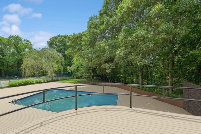 61 Hidden Cove Ct, Southampton, NY 11968 - outdoor pool with a deck and view of scattered trees