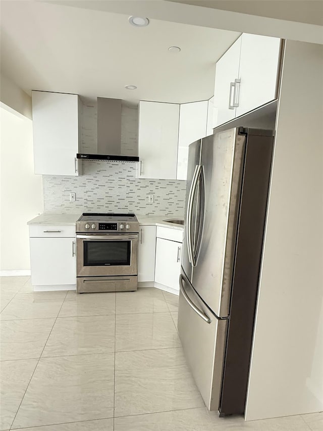 756 40th St Unit 1R, Brooklyn, NY 11232 - kitchen with appliances with stainless steel finishes, wall chimney exhaust hood, light countertops, decorative backsplash, and recessed lighting