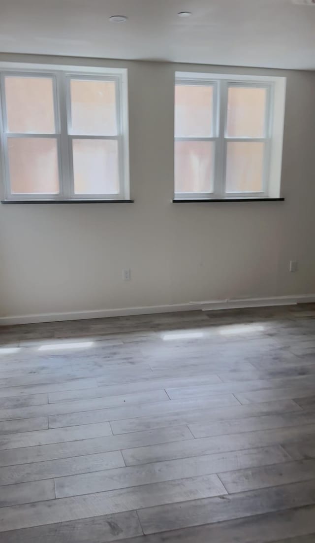 756 40th St Unit 1R, Brooklyn, NY 11232 - empty room with wood finished floors and plenty of natural light