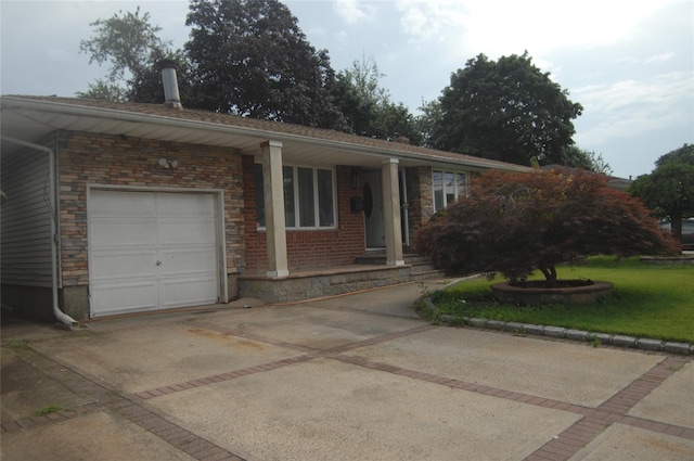 176 Floyd St, Brentwood, NY 11717 - single story home with an attached garage, driveway, brick siding, and a front yard