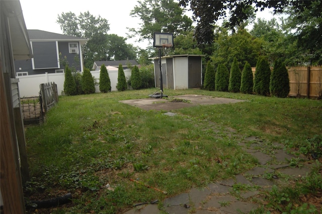 176 Floyd St, Brentwood, NY 11717 - fenced backyard featuring a storage unit