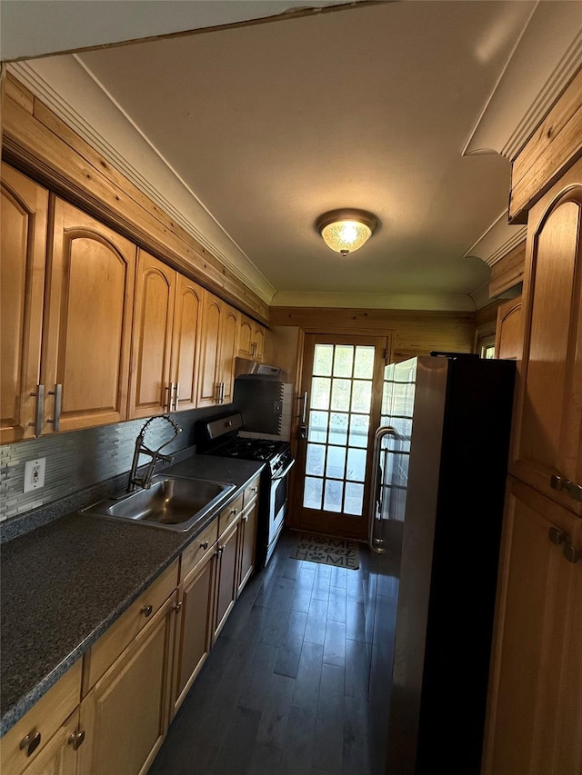 176 Floyd St, Brentwood, NY 11717 - kitchen featuring appliances with stainless steel finishes, dark countertops, dark wood-style floors, and tasteful backsplash