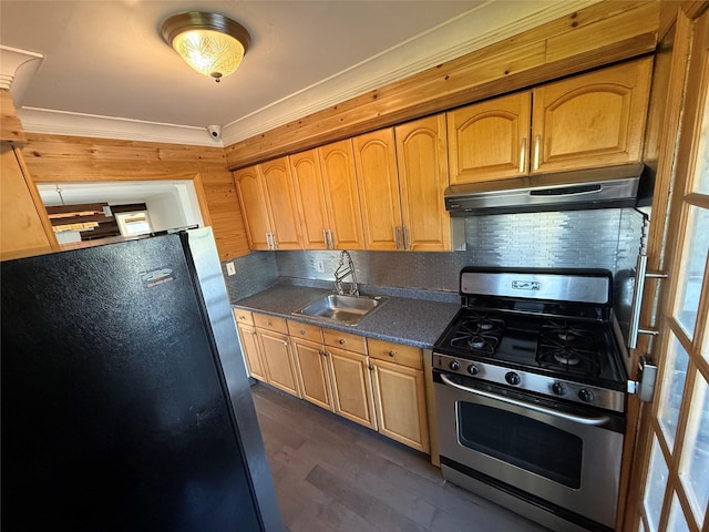 176 Floyd St, Brentwood, NY 11717 - kitchen with stainless steel gas stove, freestanding refrigerator, under cabinet range hood, backsplash, and dark wood-style floors