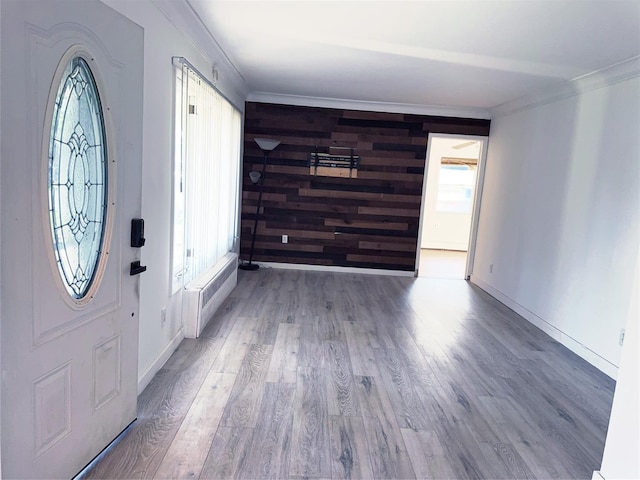 176 Floyd St, Brentwood, NY 11717 - entryway with crown molding, wood finished floors, and wood walls