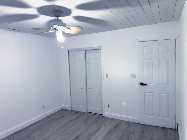 176 Floyd St, Brentwood, NY 11717 - unfurnished bedroom with wood finished floors, a closet, and a ceiling fan