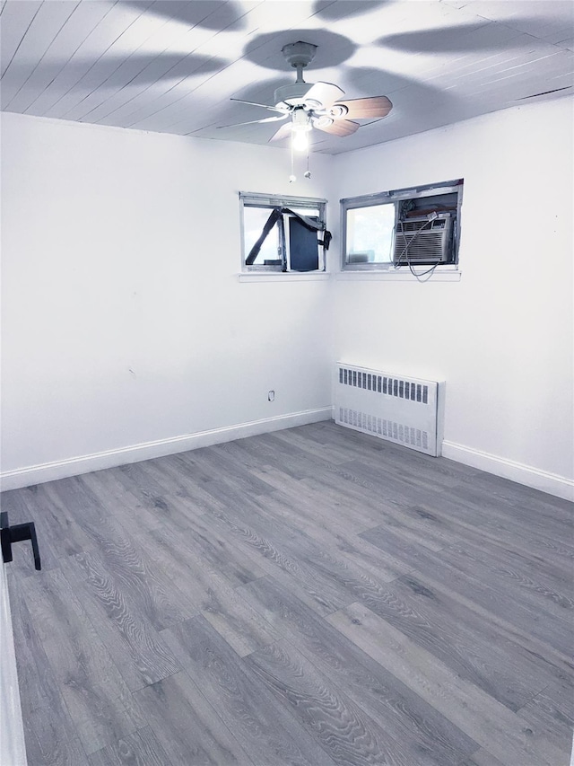 176 Floyd St, Brentwood, NY 11717 - empty room featuring radiator, ceiling fan, and wood finished floors