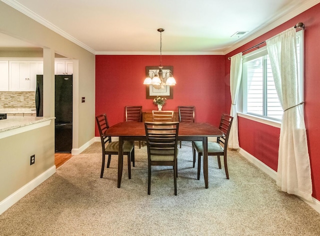 13 Knightsbridge Unit G, Poughkeepsie, NY 12603 - dining room featuring light carpet, ornamental molding, and a chandelier