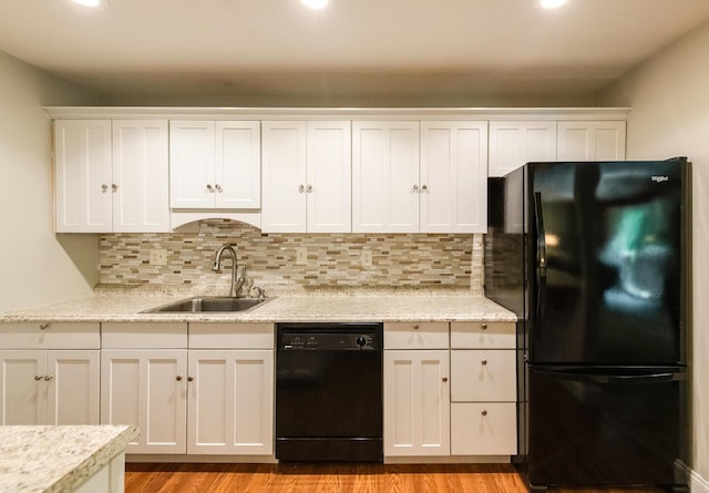 13 Knightsbridge Unit G, Poughkeepsie, NY 12603 - kitchen featuring black appliances, white cabinetry, decorative backsplash, light wood-style floors, and recessed lighting