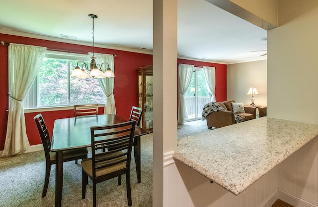 13 Knightsbridge Unit G, Poughkeepsie, NY 12603 - dining space featuring carpet floors, ornamental molding, and a chandelier