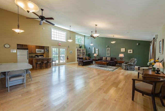 13 Knightsbridge Unit G, Poughkeepsie, NY 12603 - living room with a ceiling fan, light wood-style flooring, and a towering ceiling