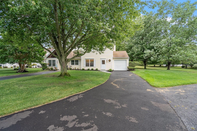 6 Doe Path, Coram, NY 11727 - obstructed view of property featuring a garage, driveway, and a front yard