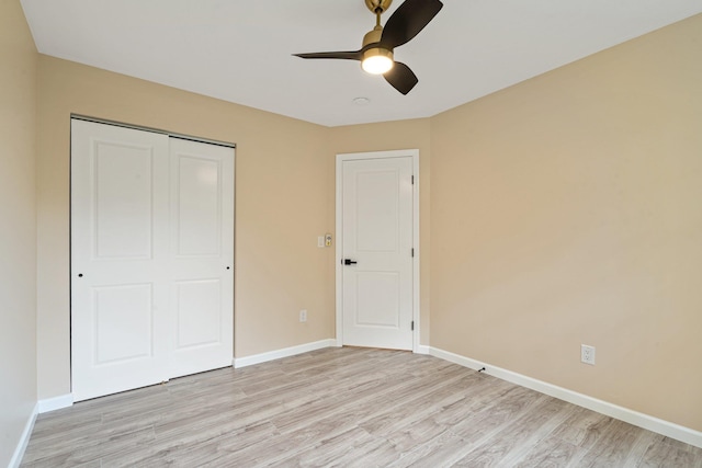 6 Doe Path, Coram, NY 11727 - unfurnished bedroom featuring light wood-style floors, a closet, and a ceiling fan