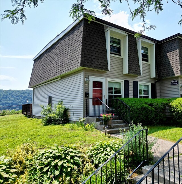 44 Hurlihe Unit 44, Poughkeepsie, NY 12601 - view of front of property featuring roof with shingles, mansard roof, and a front yard