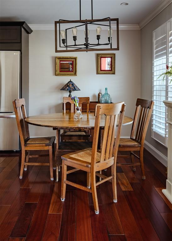 44 Hurlihe Unit 44, Poughkeepsie, NY 12601 - dining area with a chandelier, crown molding, and dark wood-style floors