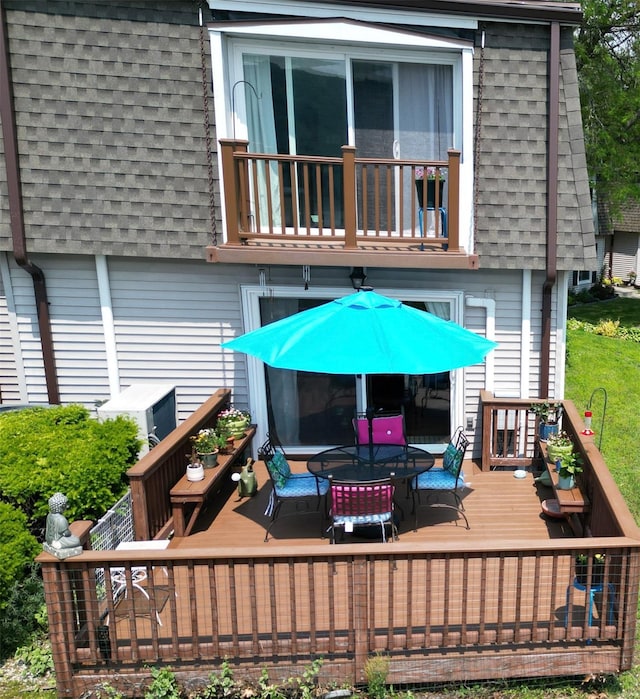 44 Hurlihe Unit 44, Poughkeepsie, NY 12601 - back of house with a shingled roof, a balcony, mansard roof, outdoor dining area, and a wooden deck