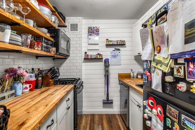 855 E Broadway Unit 4A, Long Beach, NY 11561 - kitchen with wooden counters, black appliances, dark wood-type flooring, open shelves, and backsplash