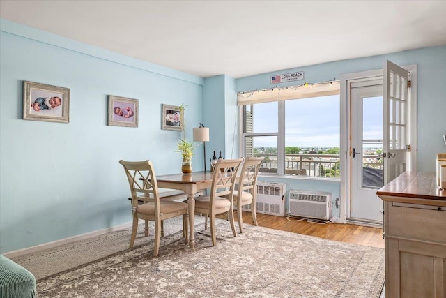 855 E Broadway Unit 4A, Long Beach, NY 11561 - dining room with wood finished floors and a wall mounted air conditioner