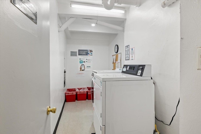 855 E Broadway Unit 4A, Long Beach, NY 11561 - community laundry featuring washer and clothes dryer and tile patterned floors