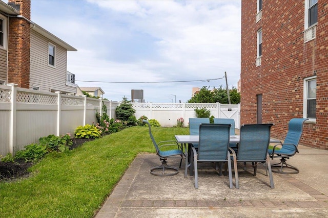 855 E Broadway Unit 4A, Long Beach, NY 11561 - fenced backyard featuring a patio area and outdoor dining space
