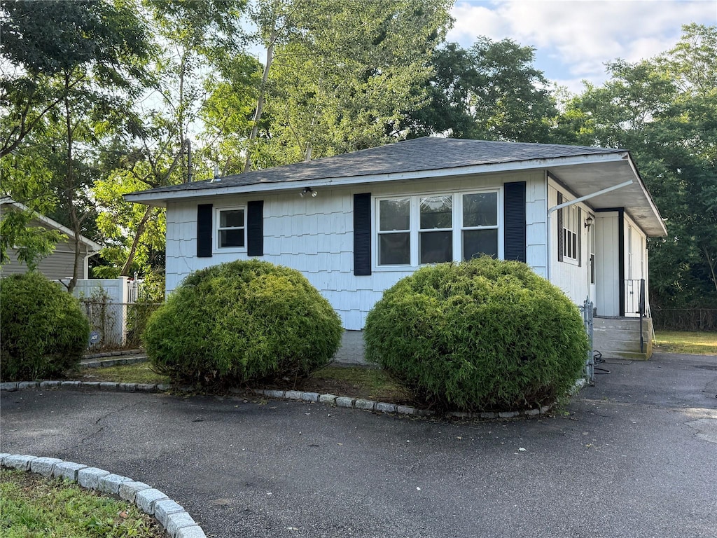 44 Edgewater Dr, Mastic Beach, NY 11951 - view of front of home with roof with shingles