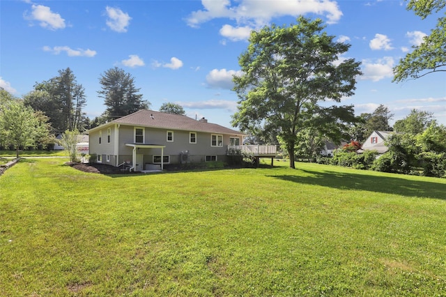 41 Forest Ave, Cortlandt Manor, NY 10567 - rear view of property featuring a yard and a wooden deck