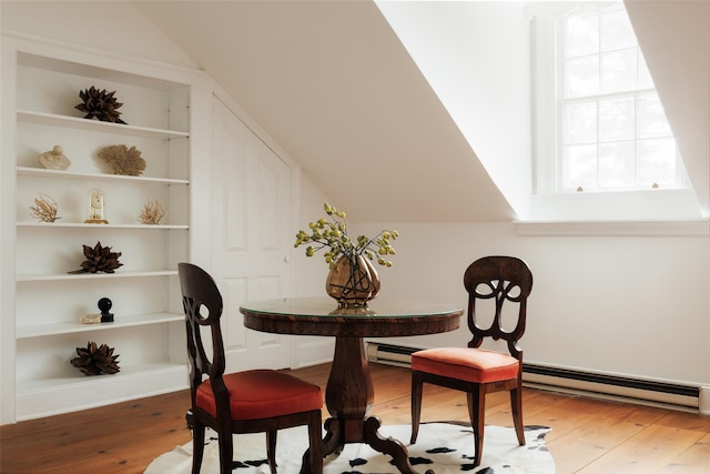 33 Scott Rd, Hudson, NY 12534 - dining area with a baseboard heating unit, wood-type flooring, and lofted ceiling