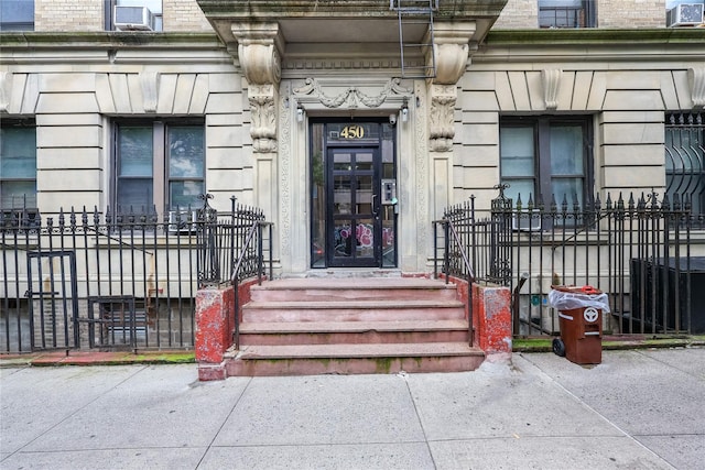 450 W 152nd St Unit 52, New York Manhattan, NY 10031 - doorway to property with cooling unit and stone siding